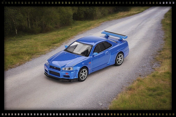 Nissan SKYLINE GT-R (R34) V- SPEC BAYSIDE BLEU 1999 (RHD) MINI GT 1:64