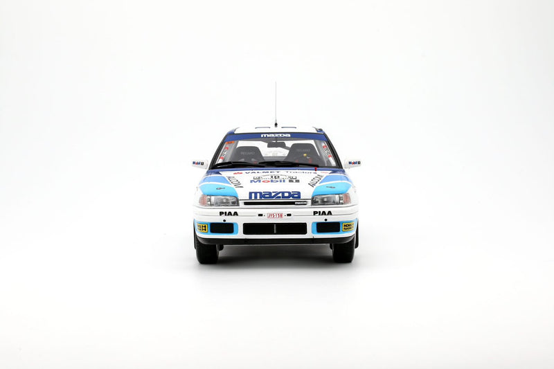 Chargez l&#39;image dans la visionneuse de la galerie, Mazda 323 GTX GR.A BLANC #10 T. MÄKINEN 1000 LACS RALLYE 1991 OTTOmobile 1:18
