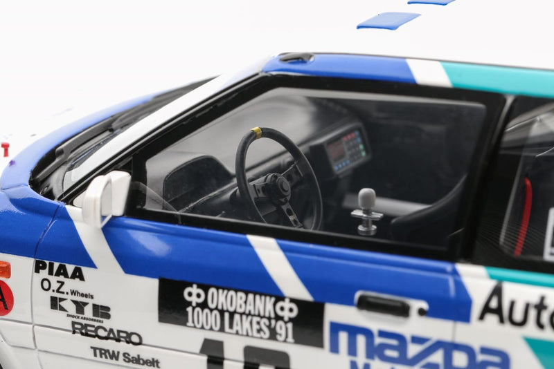 Chargez l&#39;image dans la visionneuse de la galerie, Mazda 323 GTX GR.A BLANC #10 T. MÄKINEN 1000 LACS RALLYE 1991 OTTOmobile 1:18
