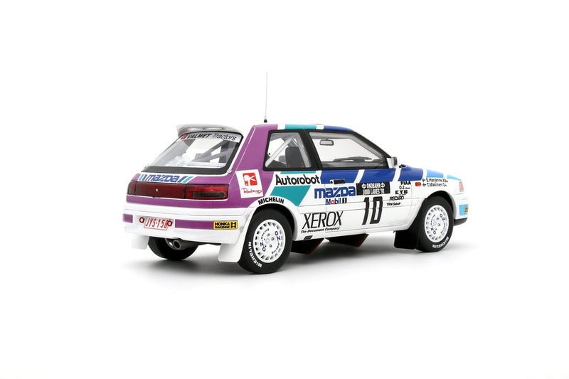 Chargez l&#39;image dans la visionneuse de la galerie, Mazda 323 GTX GR.A BLANC #10 T. MÄKINEN 1000 LACS RALLYE 1991 OTTOmobile 1:18
